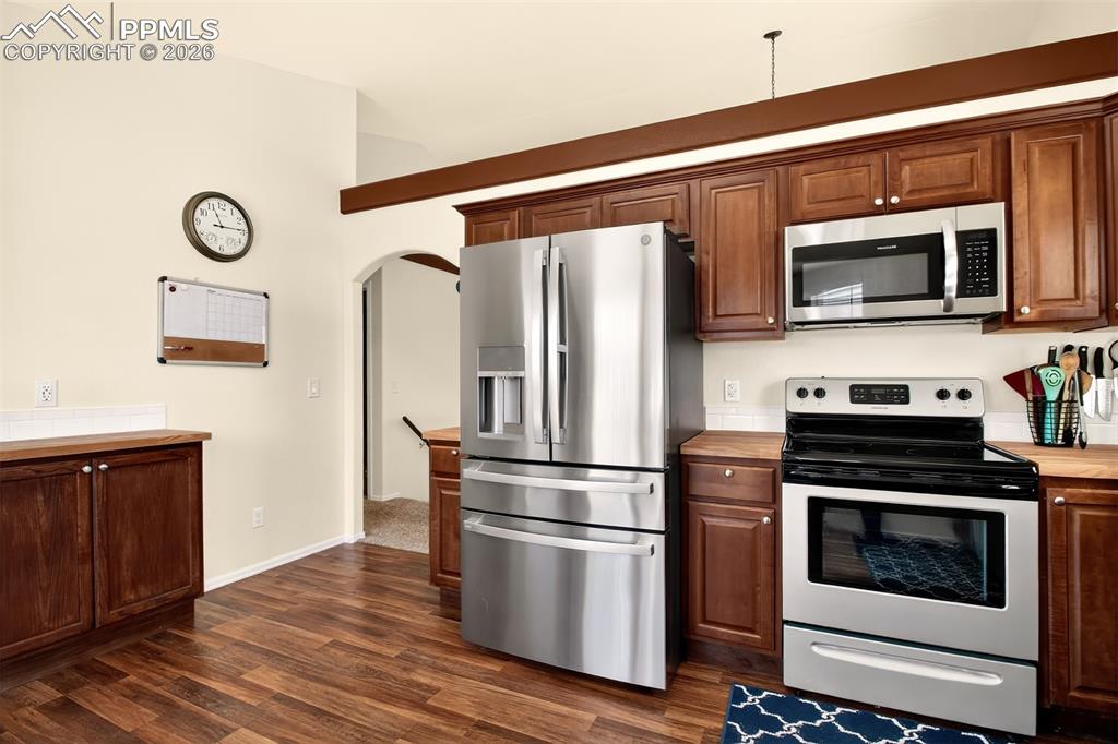 Image 9 of 36: Kitchen with stainless sleet appliances, plenty of cabinet space, butcher b