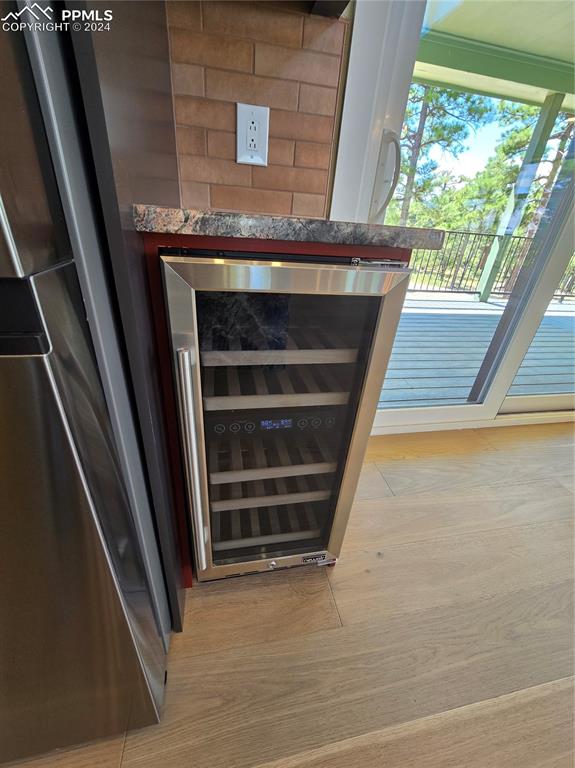 Image 21 of 50: Room details featuring beverage cooler