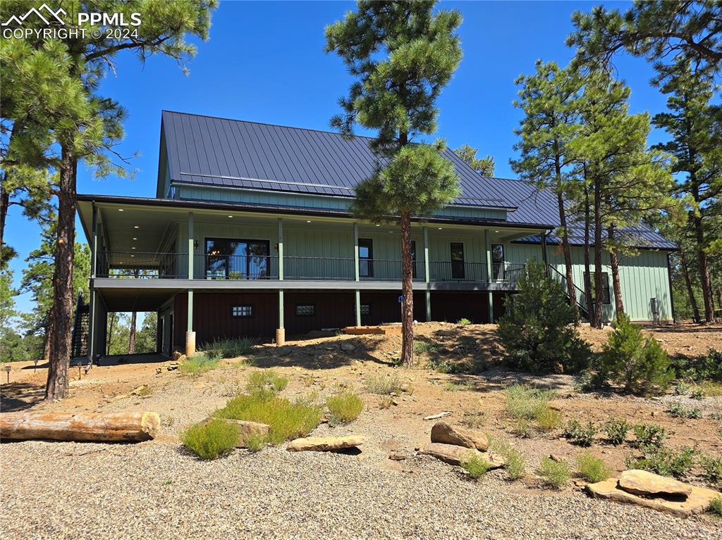 Image 7 of 50: Side view of property featuring a balcony