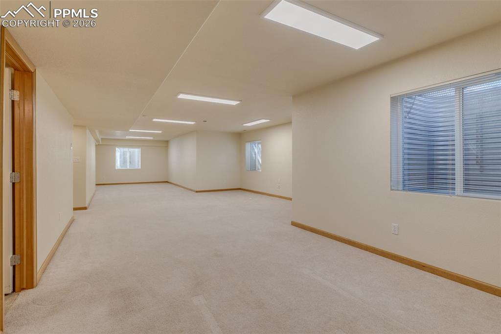 Image 43 of 48: Unfurnished room with light carpet and baseboards