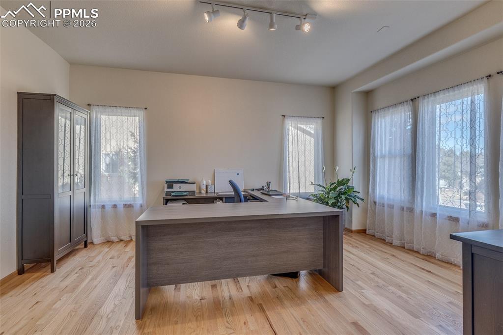 Image 7 of 48: Office area featuring rail lighting