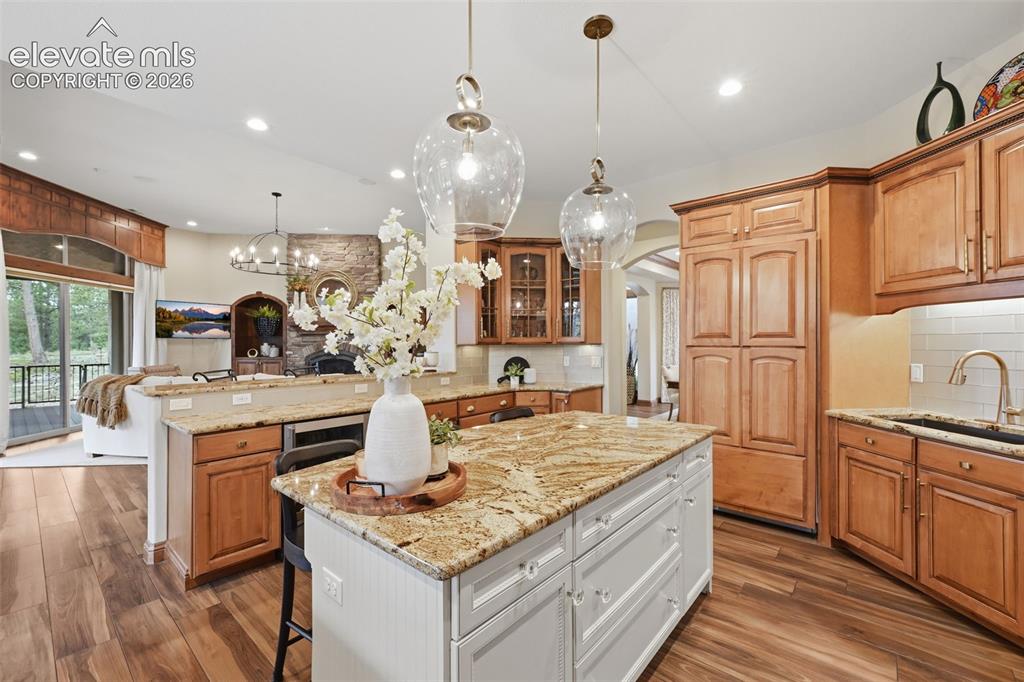 Image 10 of 50: Kitchen opens to family room for easy entertaining!