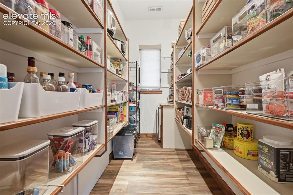 Image 14 of 50: Large walk in pantry with ice maker and window!