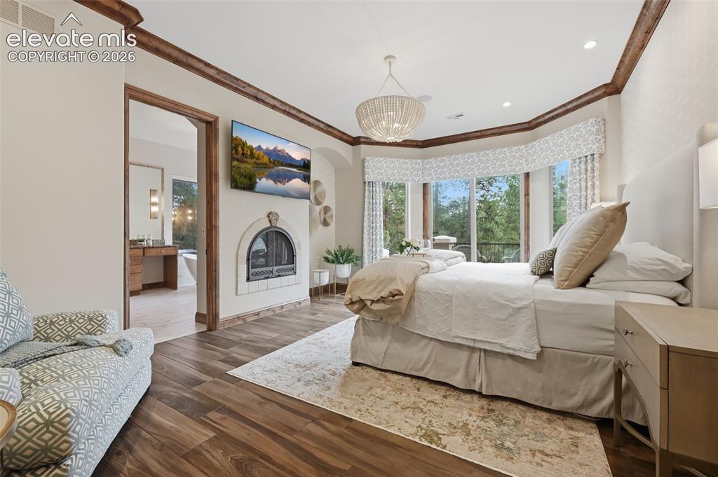 Image 19 of 50: Your main level private master retreat is an oasis from the busy with firep