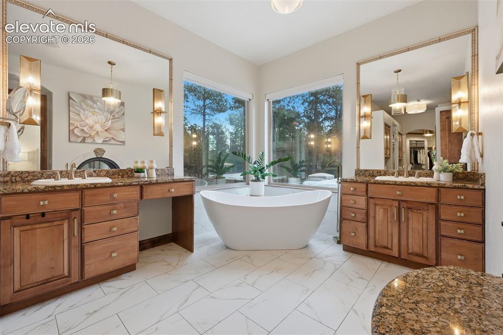 Image 23 of 50: Updated spa like master bath with free standing tub!
