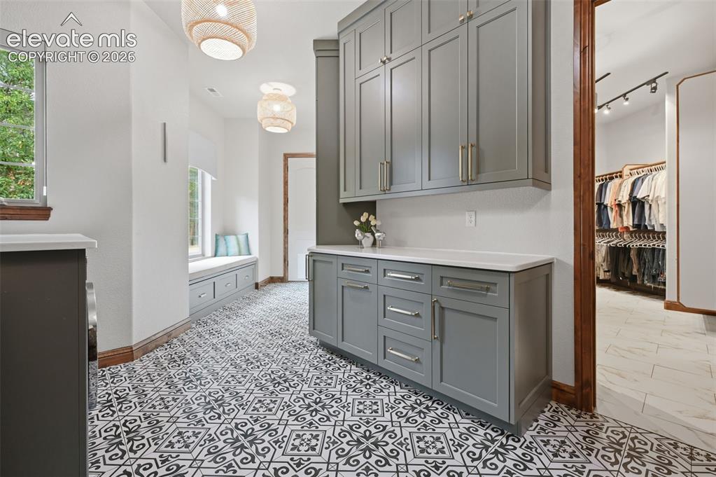 Image 26 of 50: Laundry room walks in to your massive closet for easy living!