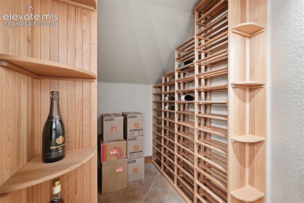 Image 32 of 50: Basement wine cellar with full storage!