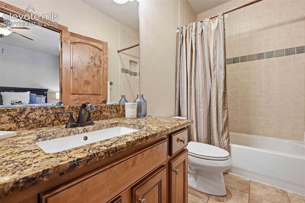 Image 40 of 50: Full bath is a junior master off bedroom #3!