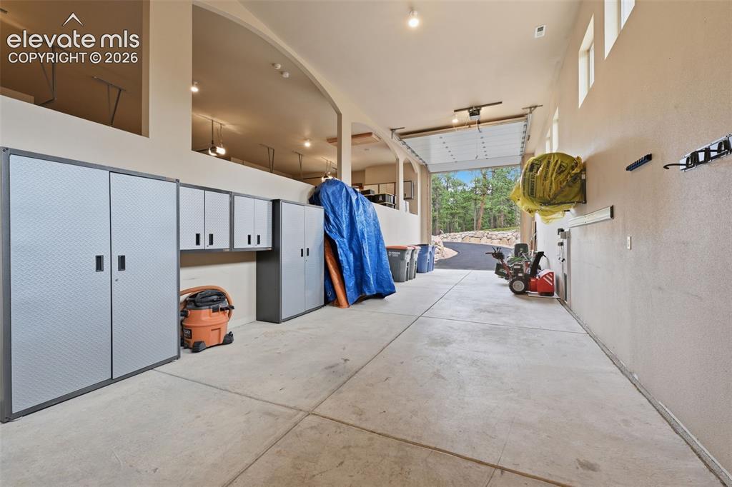 Image 45 of 50: RV garage or workshop or space for 3 more cars!