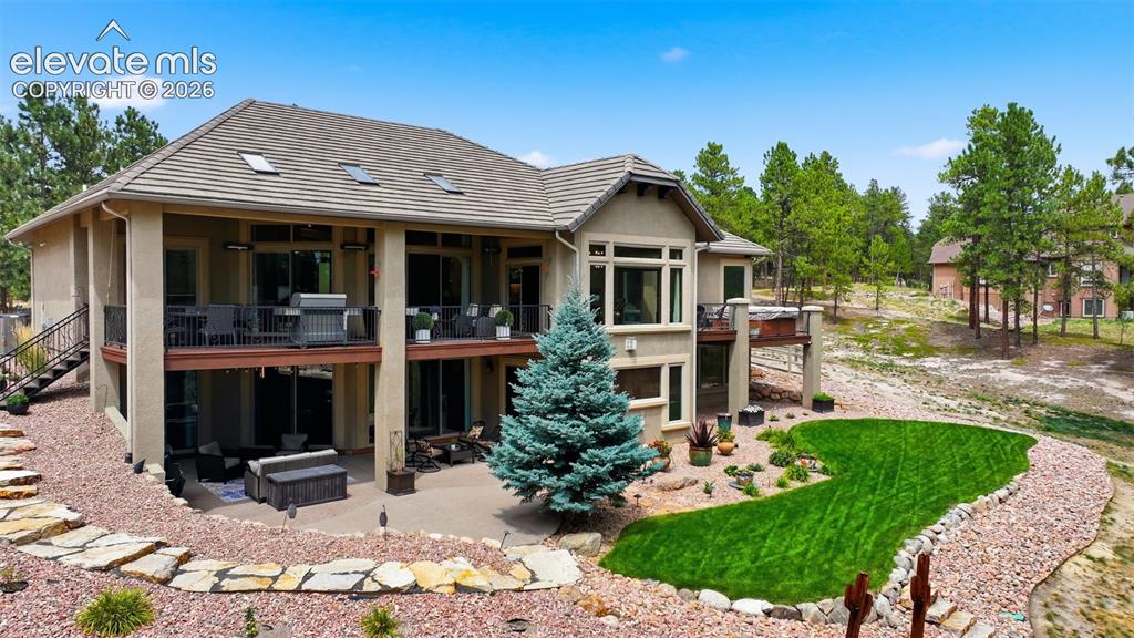 Image 46 of 50: Beautiful back yard with walks all around!
