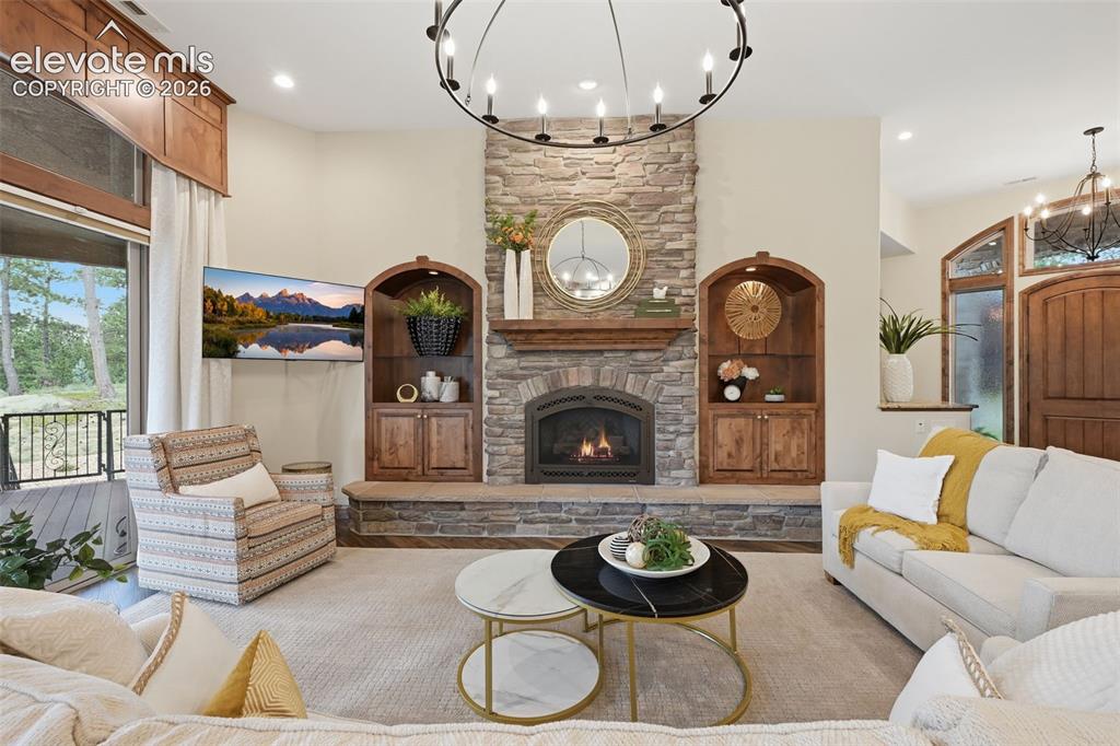 Image 6 of 50: Twelve foot ceilings and one of four fireplaces for cozy Colorado living!