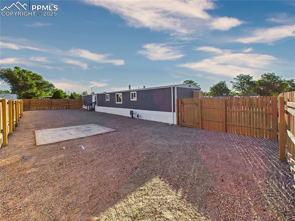 Image 39 of 43: Backyard – Fenced Area – Fully fenced backyard with a spacious gravel area 