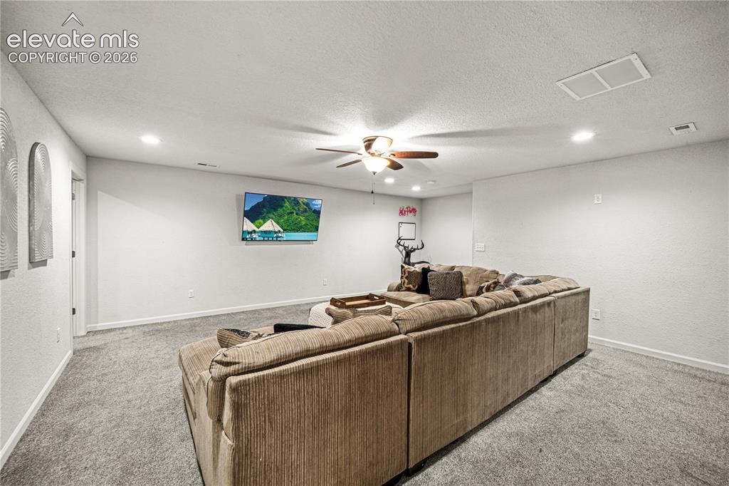 Image 31 of 50: Spacious room featuring light gray carpeting, neutral wall finishes, recess