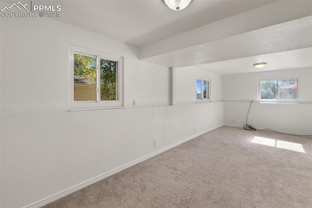 Image 28 of 47: Spare room with carpet