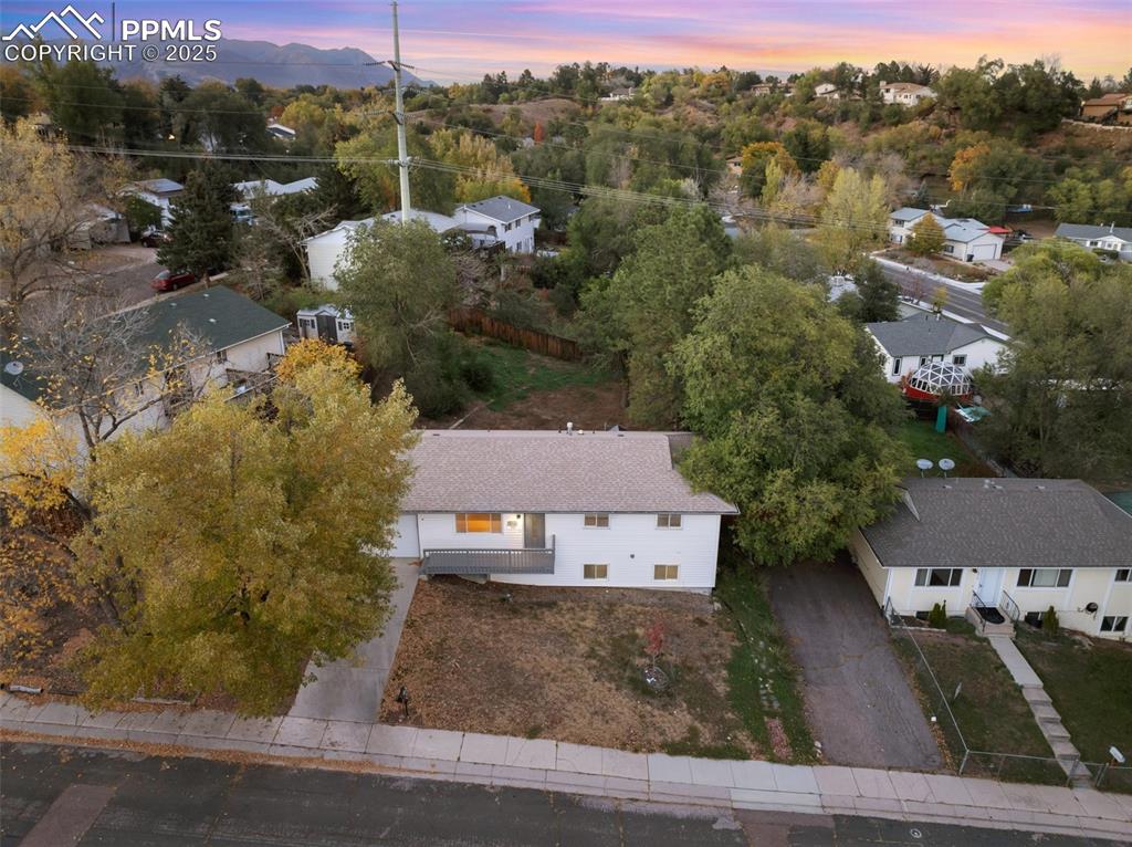 Image 44 of 47: Aerial view at dusk of a residential view