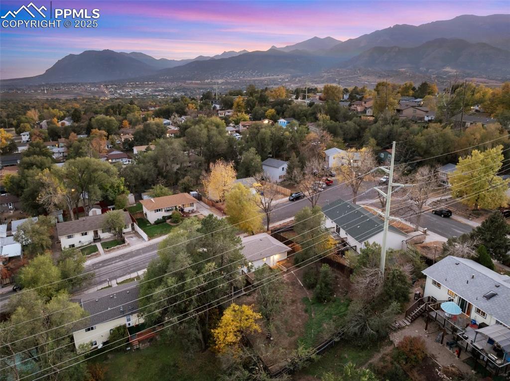 Image 7 of 47: Aerial perspective of suburban area with mountains