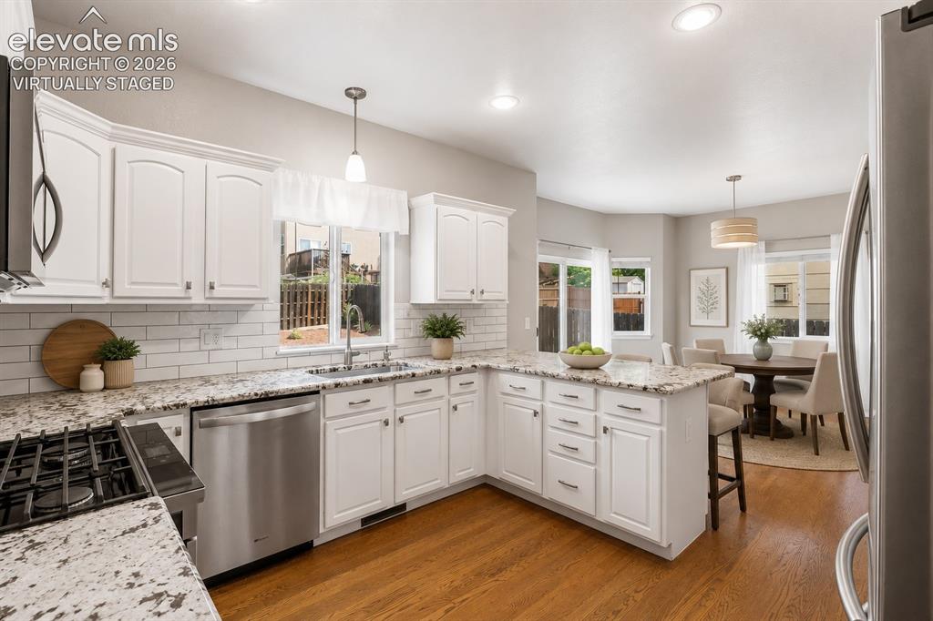 Image 12 of 46: Kitchen and breakfast area virtually staged for inspiration