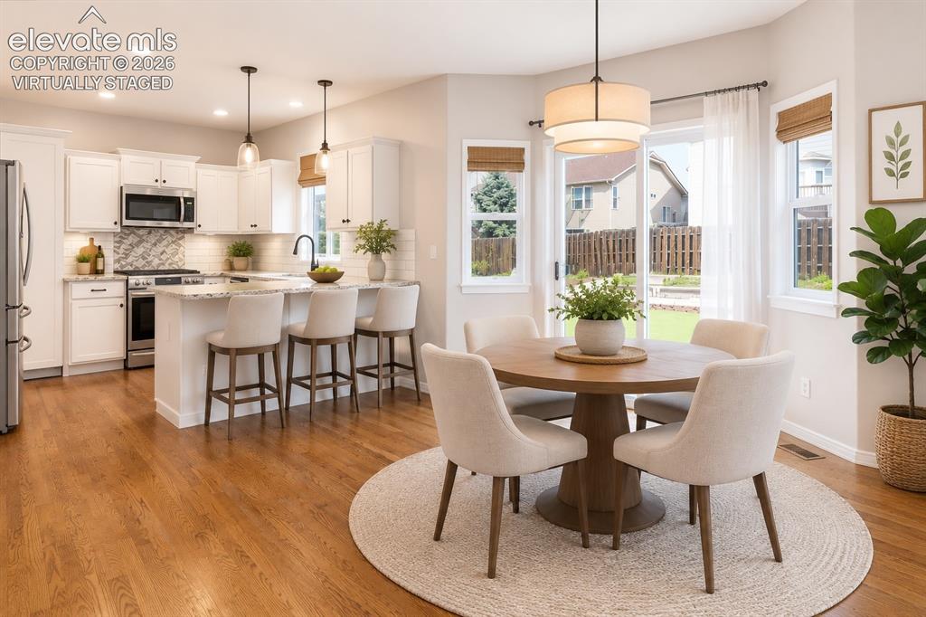 Image 14 of 46: Breakfast area and breakfast bar virtually staged for inspiration