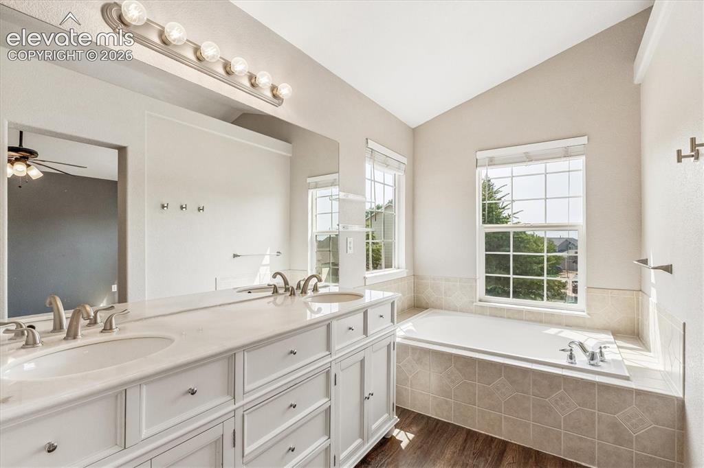 Image 19 of 46: Bright 5-piece primary bathroom with private water closet
