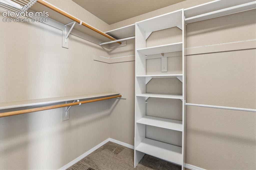 Image 22 of 46: Primary bedroom features TWO separate walk-in closets