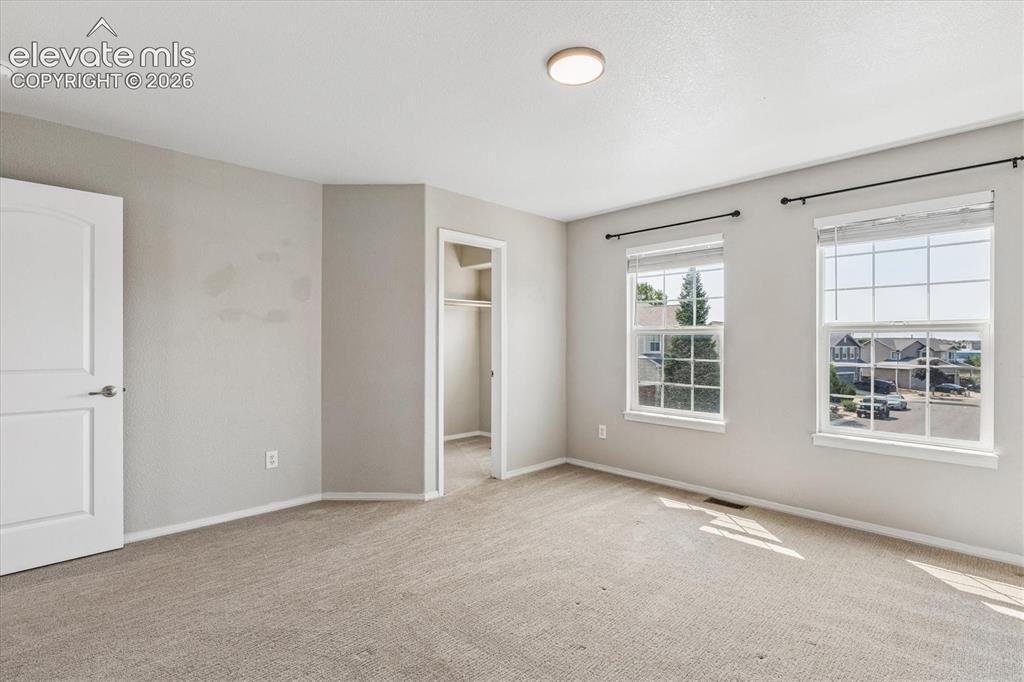 Image 24 of 46: Bedroom #2 with spacious walk-in closet