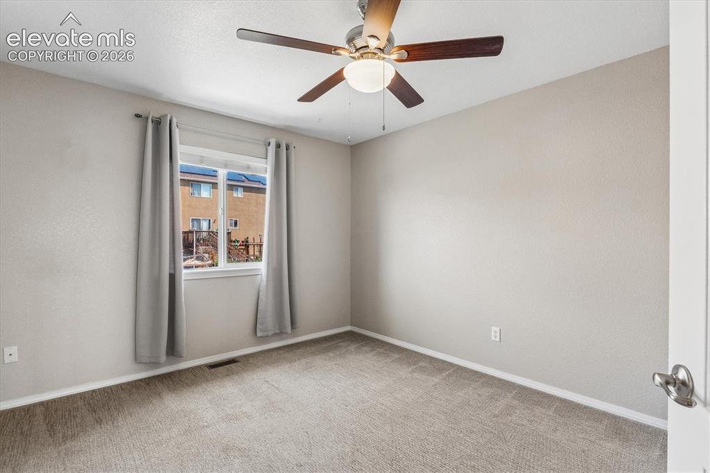 Image 27 of 46: Bedroom #3 features a ceiling fan with integrated lighting
