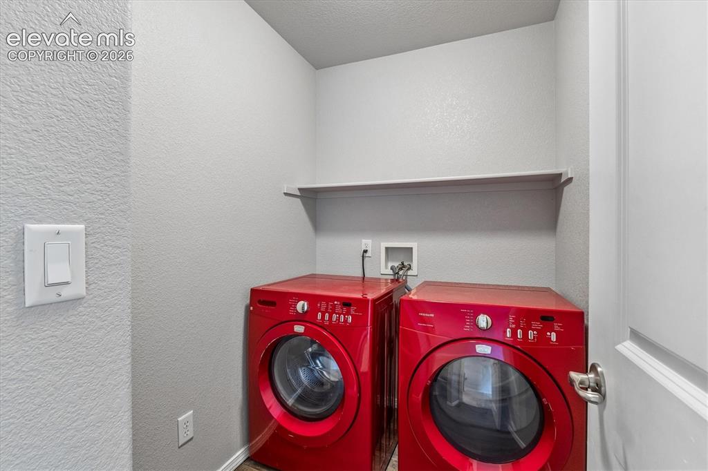 Image 31 of 46: Laundry is conveniently located on the upper floor