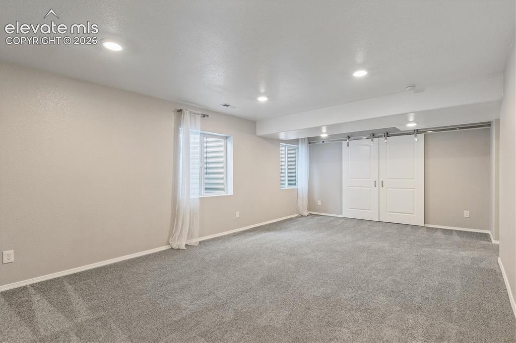 Image 35 of 46: Spacious basement family room
