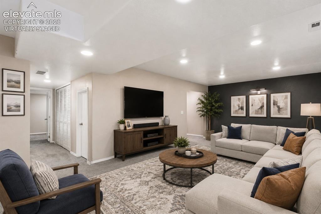 Image 37 of 46: Basement family room virtually staged for inspiration