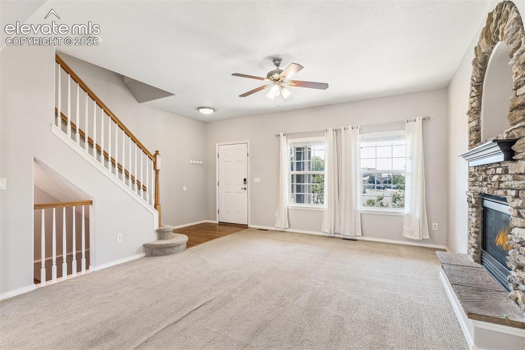 Image 4 of 46: Enter into the spacious living room flooded with natural light