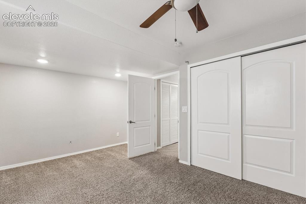 Image 40 of 46: Spacious basement bedroom features reach-in closet