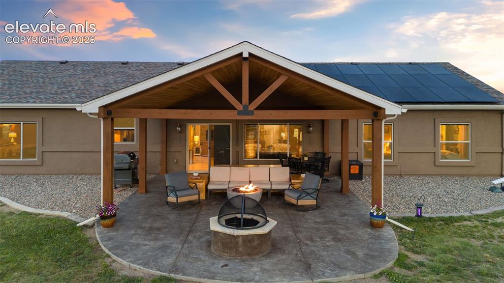 Image 2 of 48: Custom Covered Stamped Conceret Patio with Several Fire Pit Options!