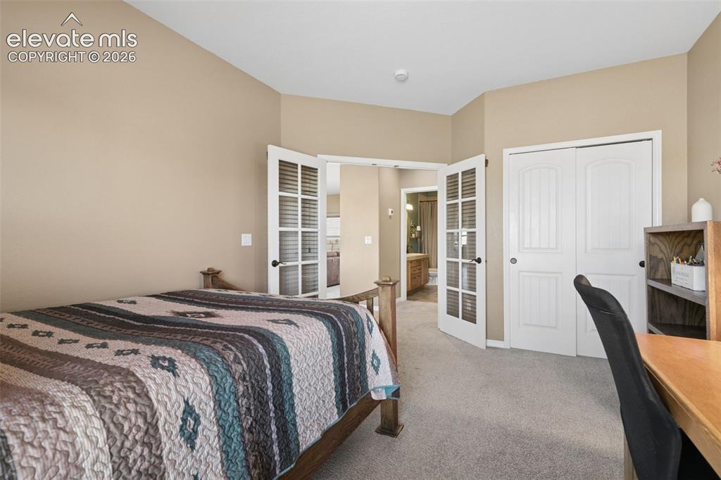 Image 25 of 48: Double French Door Entry with Privacy Blinds!