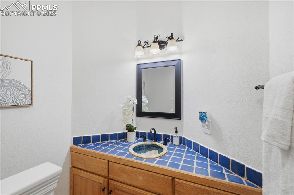 Image 32 of 47: Powder Bathroom Upper Level