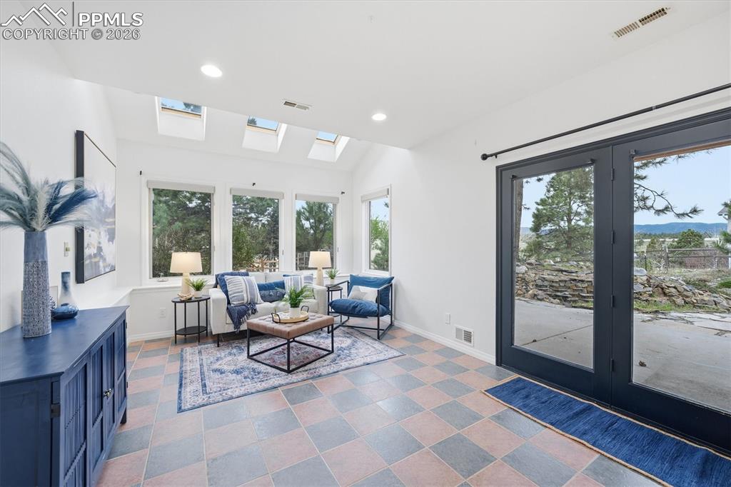 Image 34 of 47: Sun Room in Basement- walks out to the backyard
