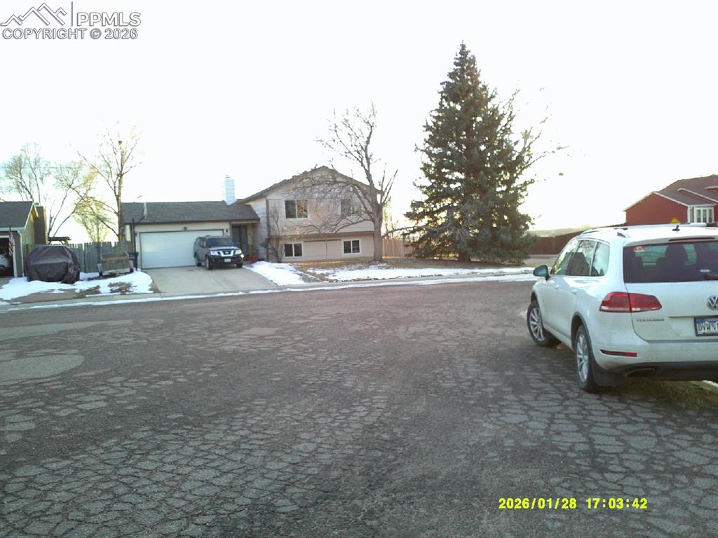 Image 4 of 22: View of asphalt street with sidewalks and curbs