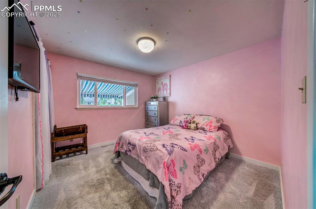 Image 22 of 32: Carpeted bedroom 