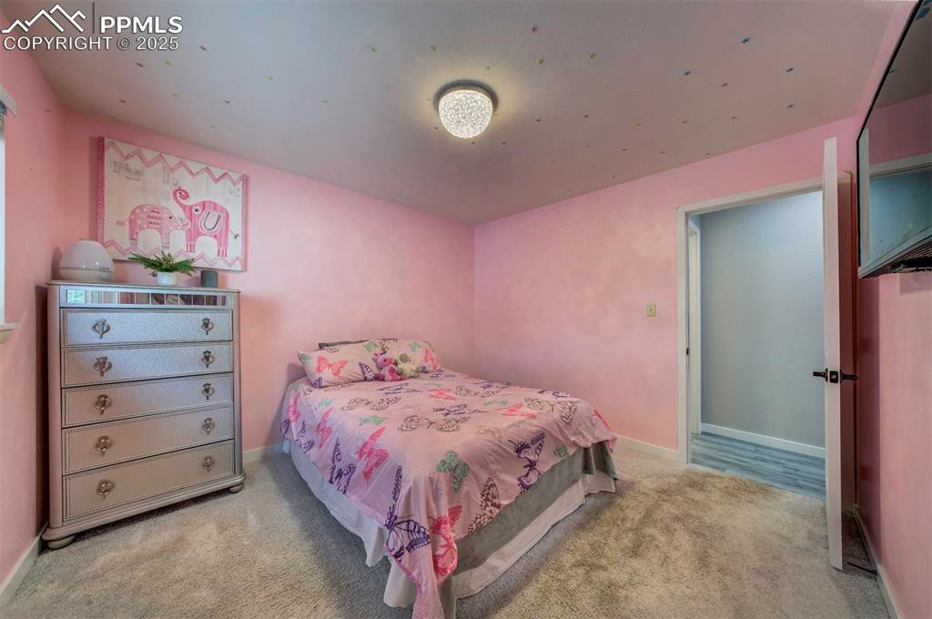 Image 23 of 32: Carpeted bedroom 