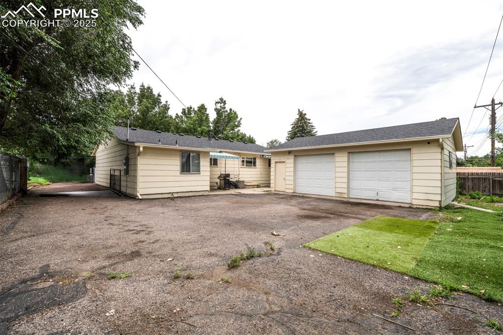 Image 29 of 32: Ranch-style home featuring garage and parking 