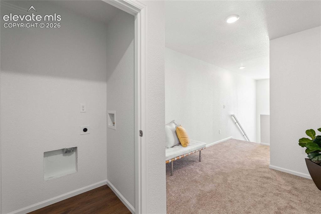 Image 10 of 30: Dedicated laundry closet with wood-finish flooring
*photos  of a model hom