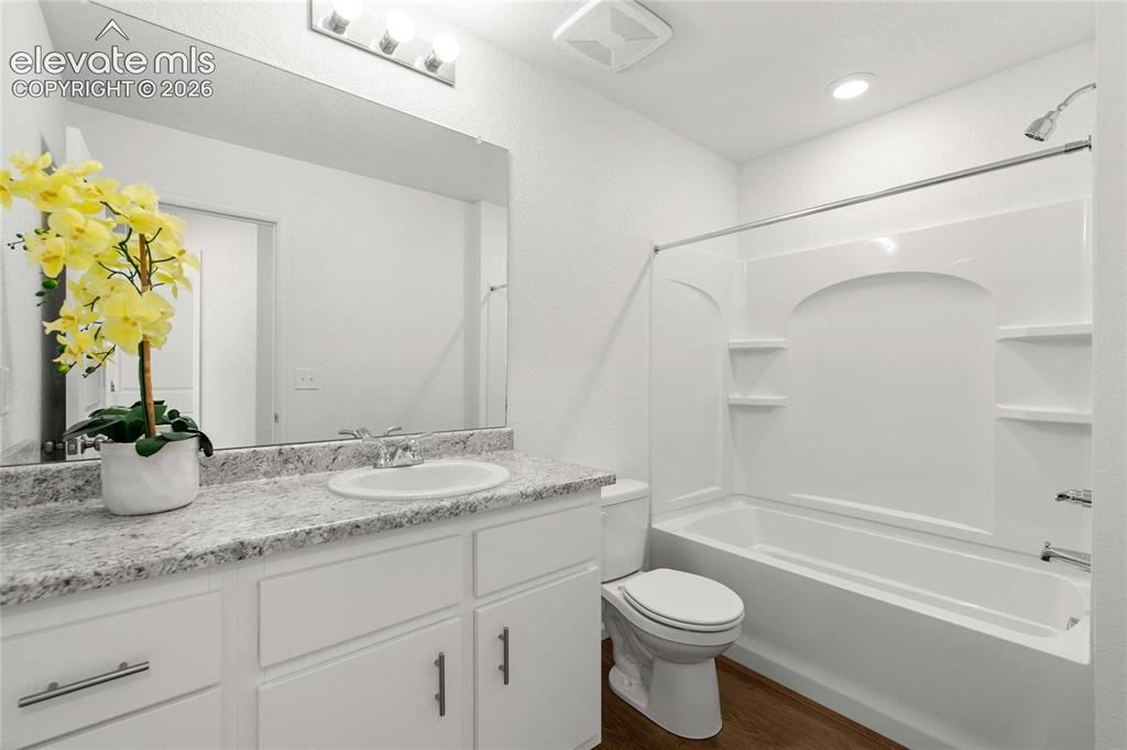 Image 22 of 30: White vanity with a light-toned countertop and an integrated sink
*photos 