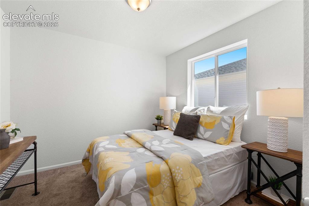 Image 28 of 30: Recessed ceiling light fixture, white painted walls, single window, and neu