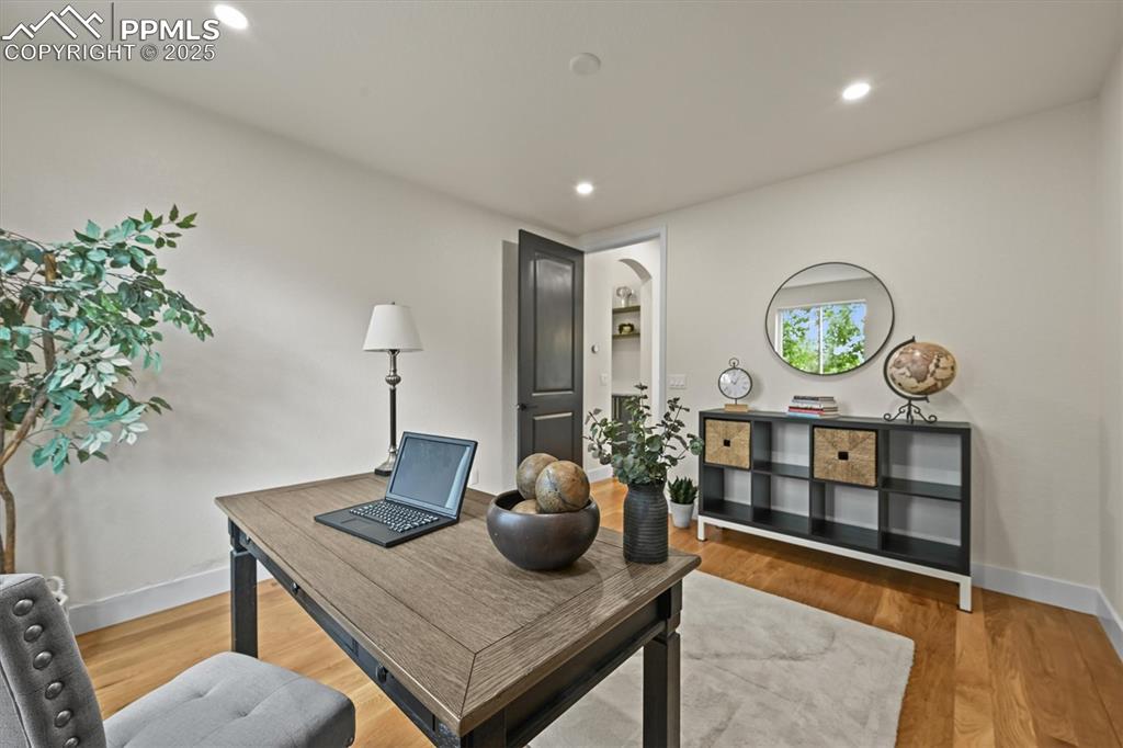 Image 31 of 47: Home office featuring light wood-style flooring and recessed lighting