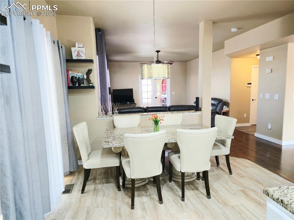 Image 12 of 48: Kitchen with appliances with stainless steel finishes, decorative backsplas