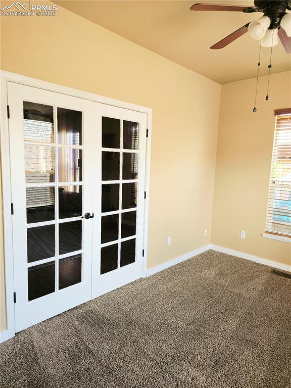 Image 16 of 48: Living room with wood finished floors, ceiling fan, and a fireplace