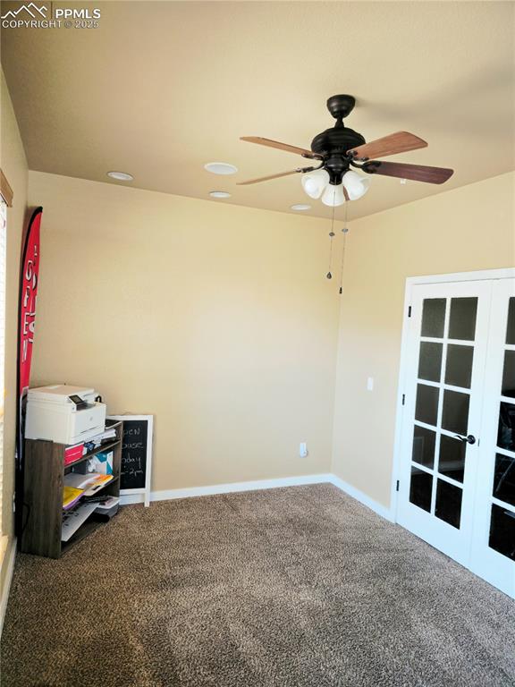 Image 17 of 48: Office main level featuring carpet, french doors, and a ceiling fan