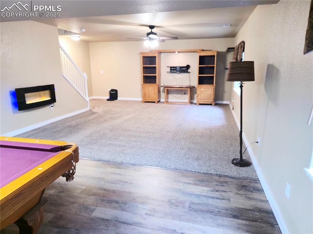 Image 40 of 48: basement movie and Game room featuring billiards table, bar area, ceiling f