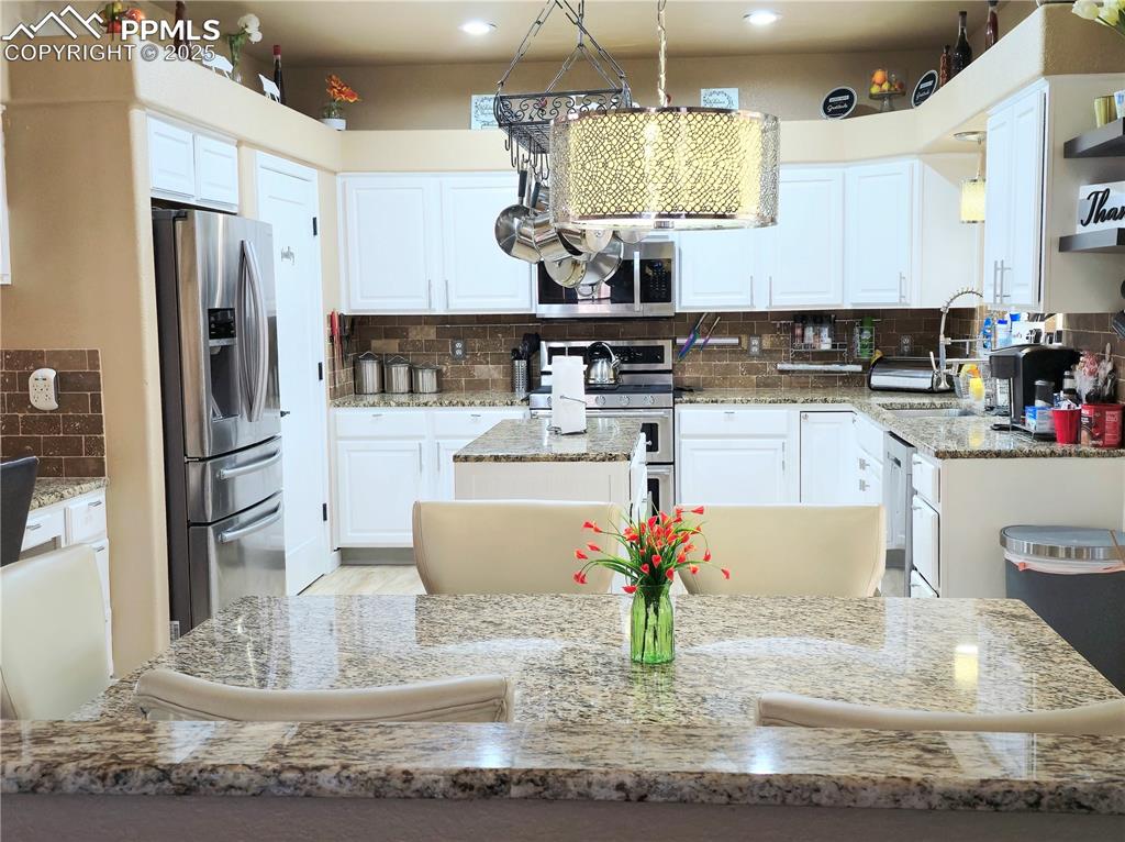 Image 9 of 48: Dining area featuring baseboards