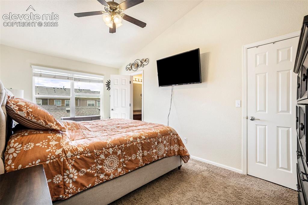 Image 13 of 24: Another view of primary bedroom before new comforter