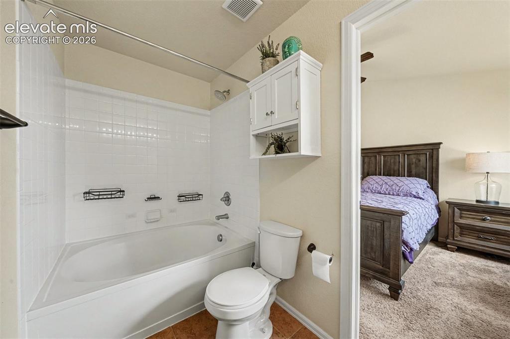 Image 15 of 24: Full size primary ensuite bathroom with extra storage